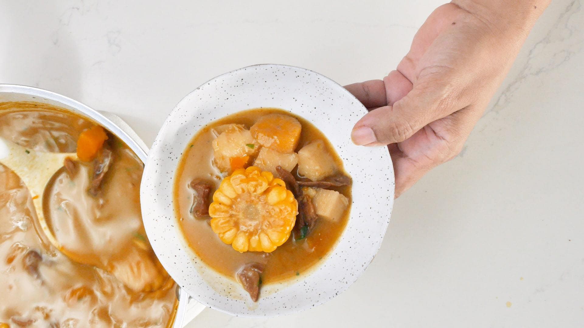 Serving vegan sancocho