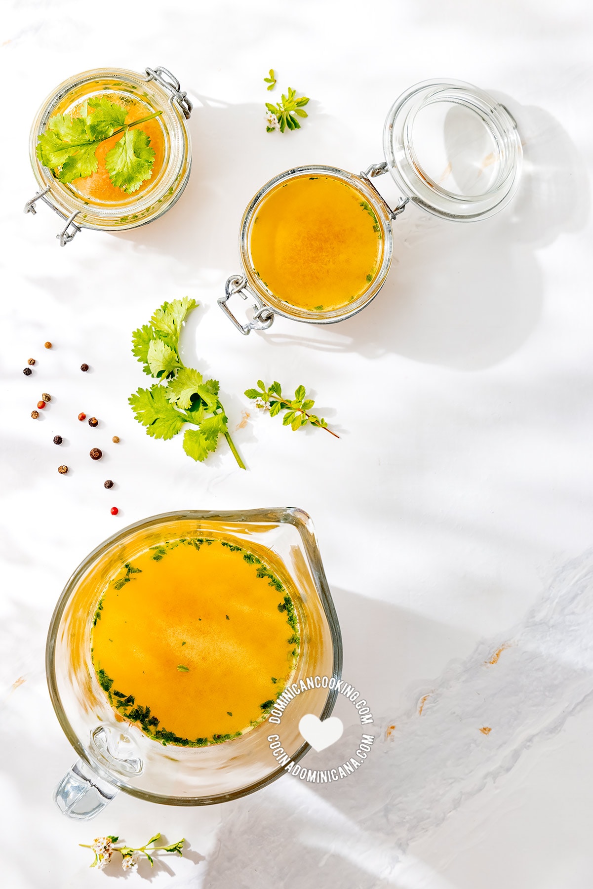 Vegetable broth in jars and pitcher