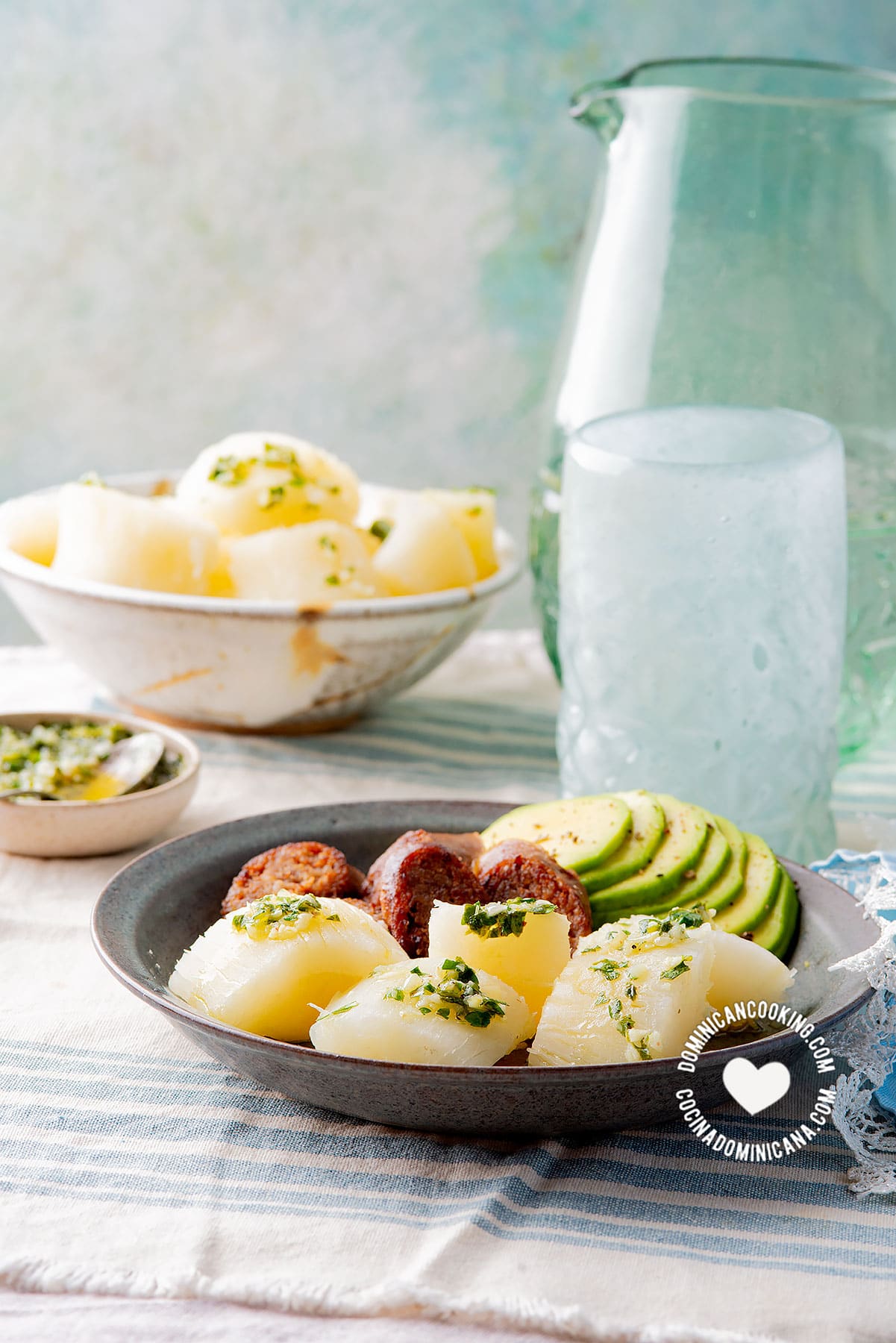 Yuca al Mojo de Ajo (Cassava with Garlic Sauce) served with avocado and longaniza