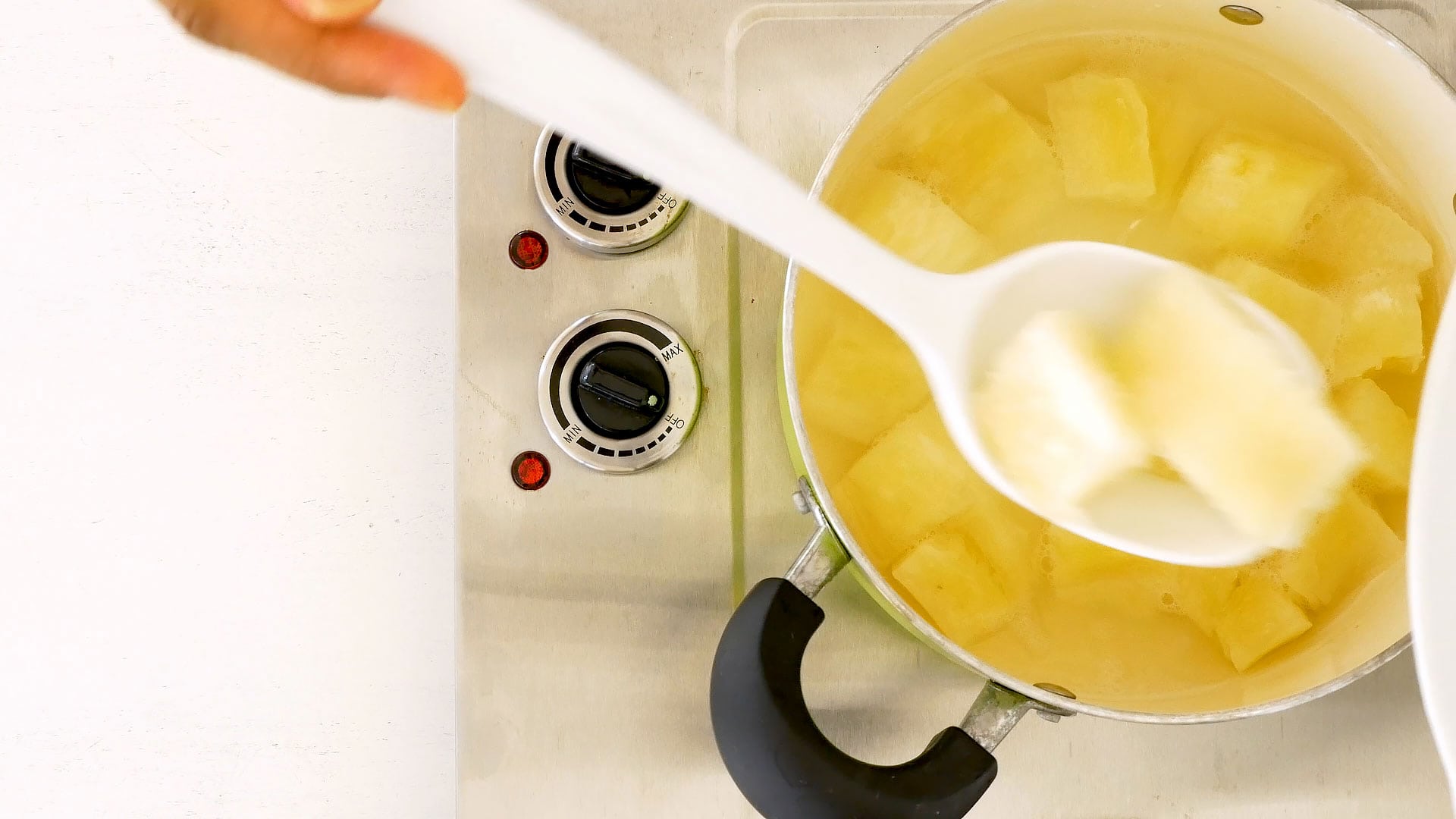 Taking boiled yuca out of the water