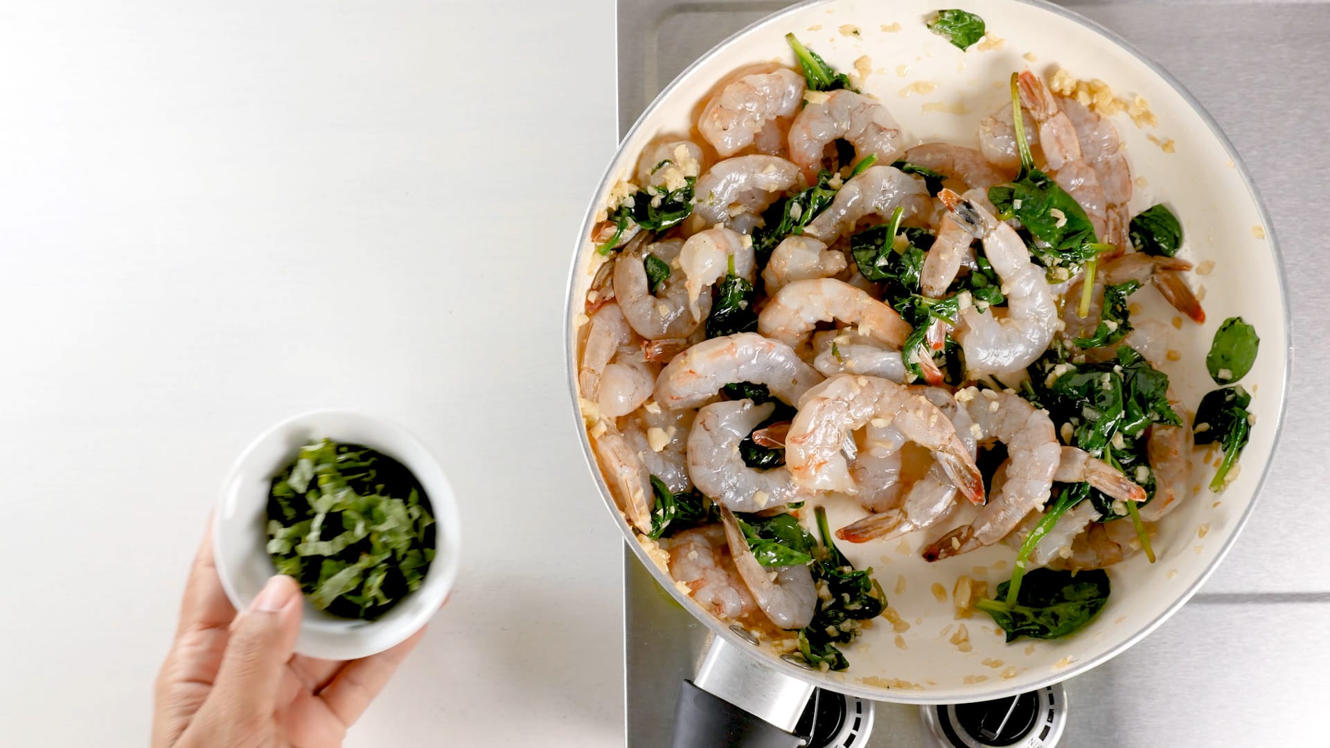 Adding parsley to shrimp